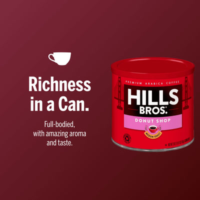 A can of Hills Bros. Coffee Donut Shop Medium Roast Ground Premium Arabica is displayed on a red background with the tagline "Richness in a Can" and a description highlighting its aromatic flavor and delicious taste.