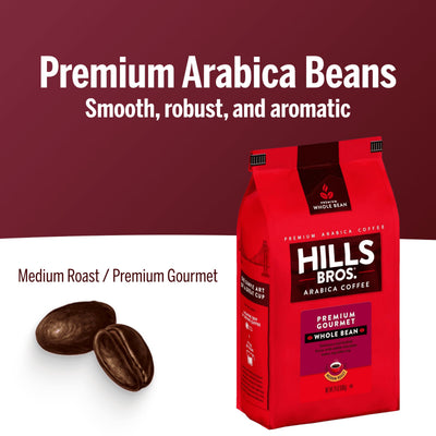 A red bag of Hills Bros. Coffee Premium Gourmet Medium Roast Whole Bean, made from premium Arabica beans, sits beside two coffee beans on a white surface. This gluten free blend delivers rich, gourmet flavor in every cup.