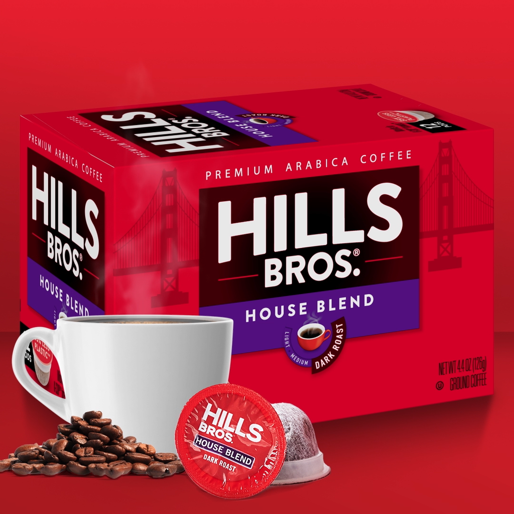 A box of Hills Bros House Blend Premium Arabica Coffee, featuring a cup of coffee, coffee beans, and a single-serve pod in front of a red background with a silhouette of a bridge.