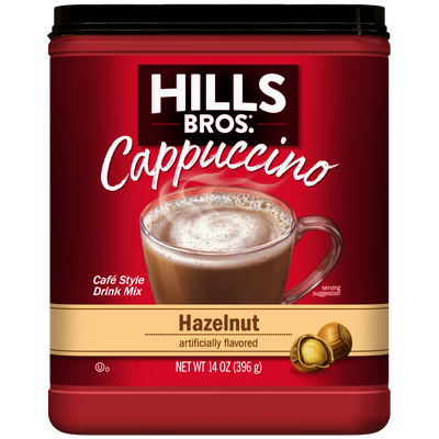 A 14 oz container of Hills Bros. Cappuccino Hazelnut - Instant Cappuccino Mix, featuring a label with a clear mug filled with cappuccino and hazelnuts. Enjoy this delicious instant cappuccino mix for a rich and creamy treat anytime.