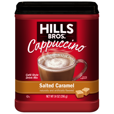A container of Hills Bros. Cappuccino Salted Caramel - Instant Cappuccino Mix, showcasing an inviting image of a cappuccino and caramel pieces on the front, perfect for savoring an instant cappuccino with a rich, creamy salted caramel flavor.