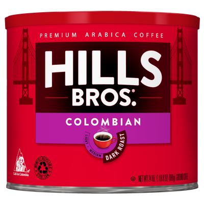 A red can of Hills Bros. Coffee Colombian Dark Roast Ground, made from premium arabica coffee beans, features the iconic Golden Gate Bridge graphic and product details on the label.