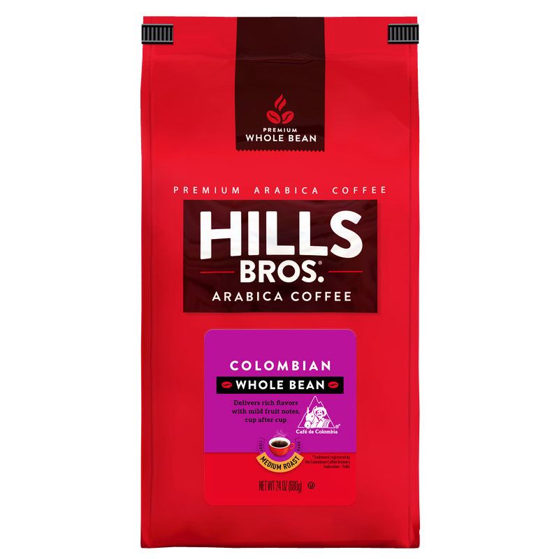 A red bag of Hills Bros. Coffee 100% Colombian Medium Roast Whole Bean, crafted from premium Arabica beans, features purple and yellow label accents highlighting flavor notes and a net weight of 24 oz (680g).