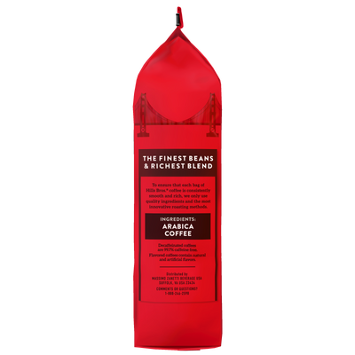 A red coffee bag features the Hills Bros. Coffee logo and showcases their “100% Colombian - Medium Roast - Whole Bean - Premium Arabica” selection, with text detailing ingredients and distributor information, plus a graphic of a bridge at the top.