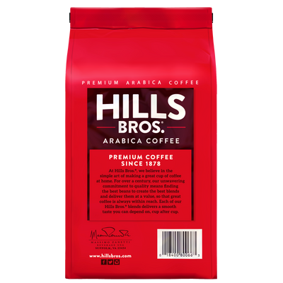 A red bag of Hills Bros. Coffee Donut Shop Medium Roast Whole Bean Premium Arabica, with white text and a description highlighting the brand’s tradition and dedication to quality coffee since 1878.