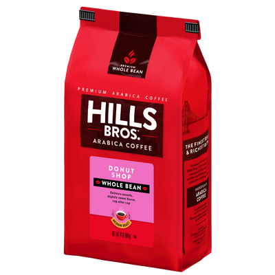 A red bag of Hills Bros. Coffee Donut Shop Medium Roast Whole Bean, made with premium Arabica beans, featuring product details and vibrant imagery of the Golden Gate Bridge.