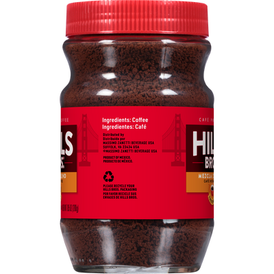 A clear plastic jar with a red lid contains Hills Bros. Coffee Original Blend Medium Roast Instant Coffee. The red label displays ingredients and recycling information in both English and Spanish.