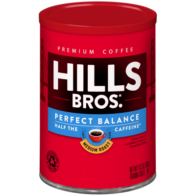 A red canister of Hills Bros. Coffee Perfect Balance Medium Roast Ground Coffee, made from premium coffee beans, featuring “Half the Caffeine” text and a coffee cup image on the label.