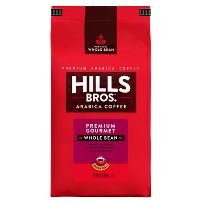 A 24-ounce red bag of Hills Bros. Coffee Premium Gourmet Medium Roast Whole Bean, made with premium Arabica coffee beans, featuring white and gold text and a coffee cup image on the front. This gluten free blend delivers rich, gourmet flavor in every cup.