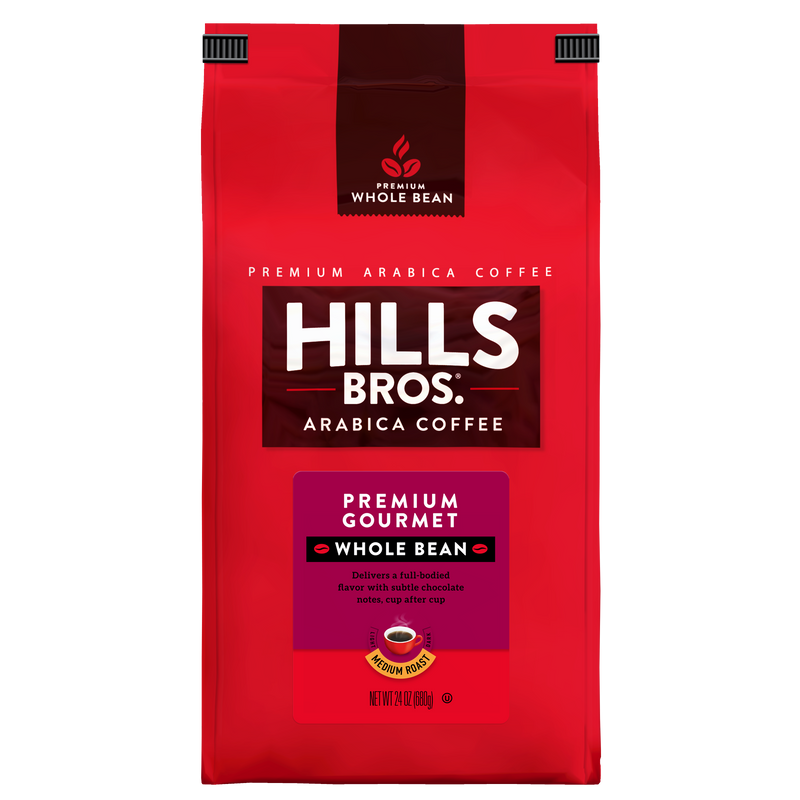 A 24-ounce red bag of Hills Bros. Coffee Premium Gourmet Medium Roast Whole Bean, made with premium Arabica coffee beans, featuring white and gold text and a coffee cup image on the front. This gluten free blend delivers rich, gourmet flavor in every cup.